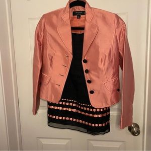 Coral. And black suit